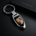 Premium automotive key chain with sleek metal design on dark background